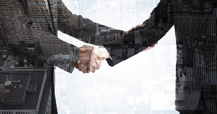 Men shake hands to complete deal.